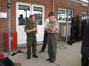 Left: COSCAP with Lt Cdr Soapy Watson (face hidden) and PO(D) Whiskey Walker having a close look at the set