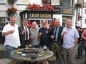 Tim Hadley, Sandy Sanders, Tim Sizer, Rob Hoole, Cris Ballinger and Tug Wilson raise a glass in Dave Ellis's memory