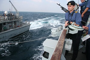 Gunnery Officer Lt Matt Besant oversees a Light Line Transfer with HMS Blyth