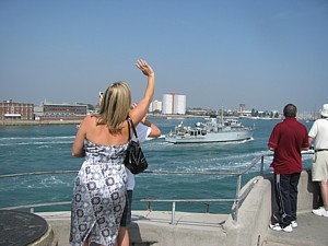 A final wave at Dad's ship from Tina and Louis