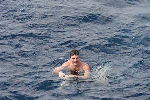 HMS Ramsey's CO, Lt Cdr Nick Borbone, enjoys 'Hands to Bathe' in the Red Sea