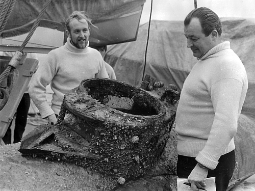 HMS Reclaim's Chief Diver Derek 'Nobby' Clark and Diving Officer Les Maynard inspect Welman