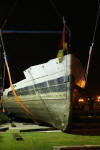 HMS Kellington's hull being lifted ashore