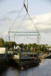 HMS Kellington's hull being lifted ashore