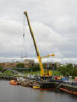 HMS Kellington's hull being lifted ashore