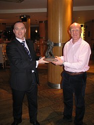 Paul Haynes presenting Chris Ameye with CDLSE figurine