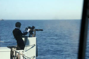 AB(MW) Kieron Putt fires Ledbury's port Mk 44 MiniGun during a gunnery serial off Corsica